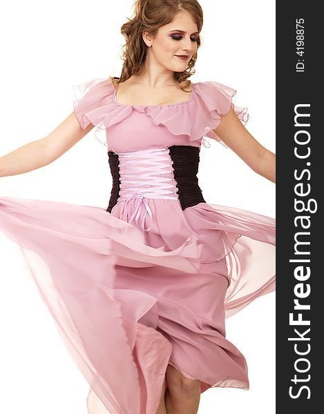 Fashion shot of a caucasian girl throwing her dress to create motion