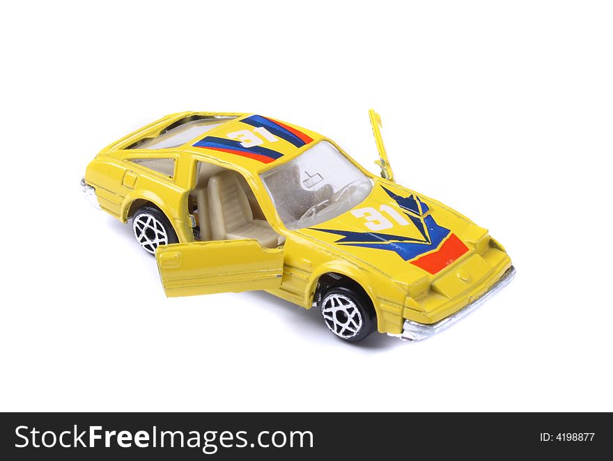 Yellow car toy on the white background