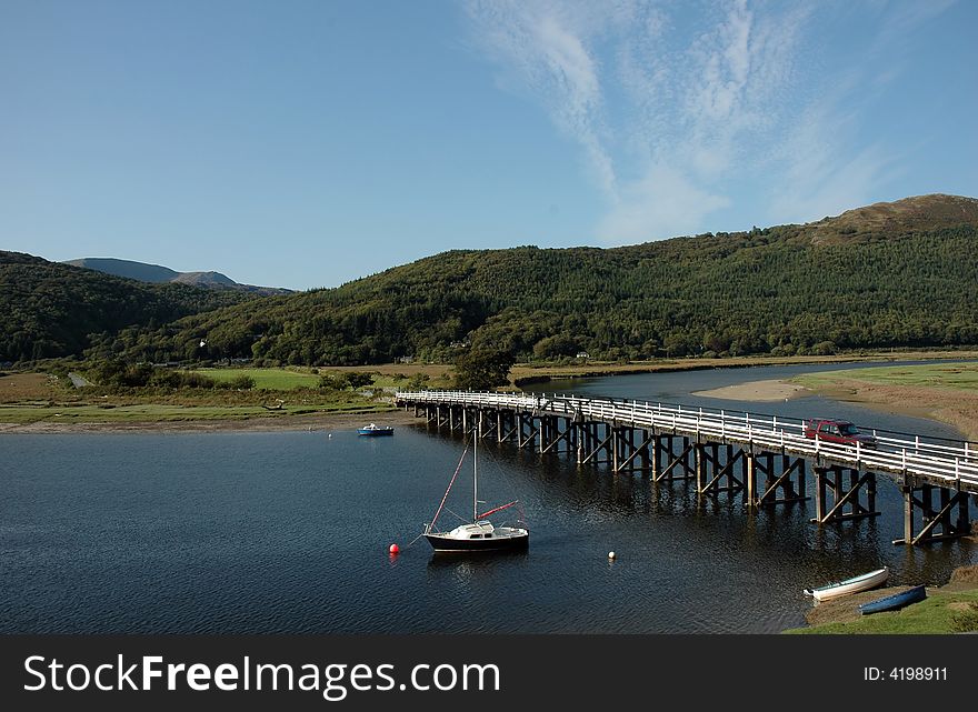 A view of penmaenpool toll bridge in snowdonia, north wales. A view of penmaenpool toll bridge in snowdonia, north wales.