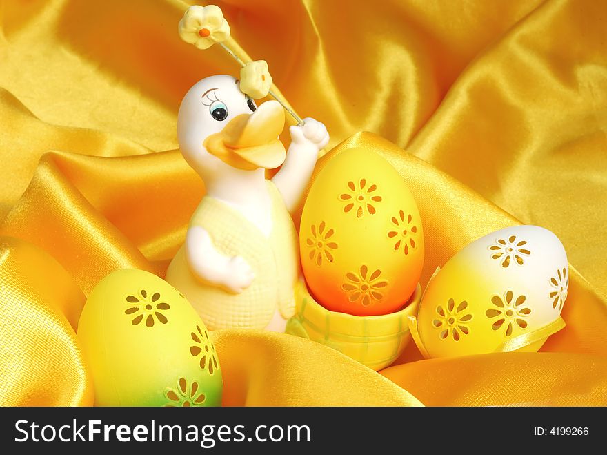 Easter eggs on golden sateen background