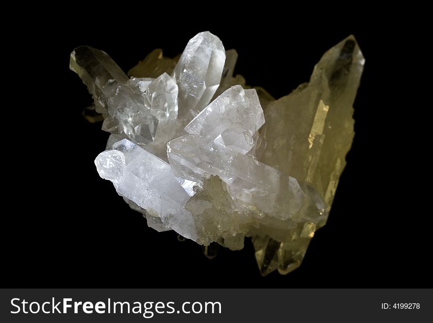 Rock crystal in front of a black background. Rock crystal in front of a black background