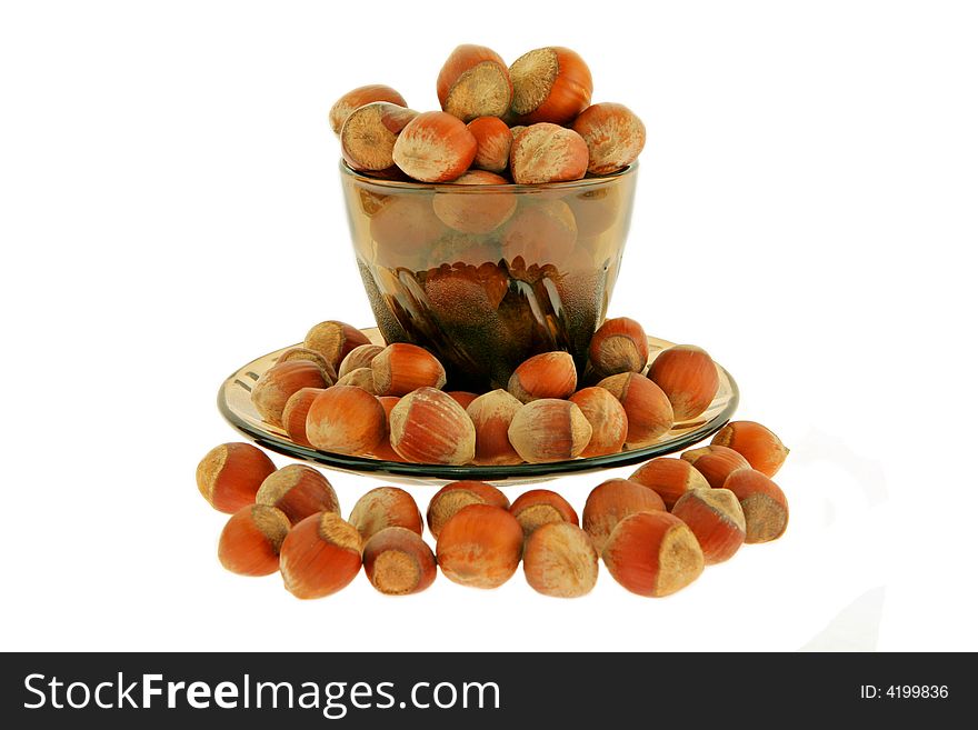 Isolated Nuts a filbert In a cup On a plate