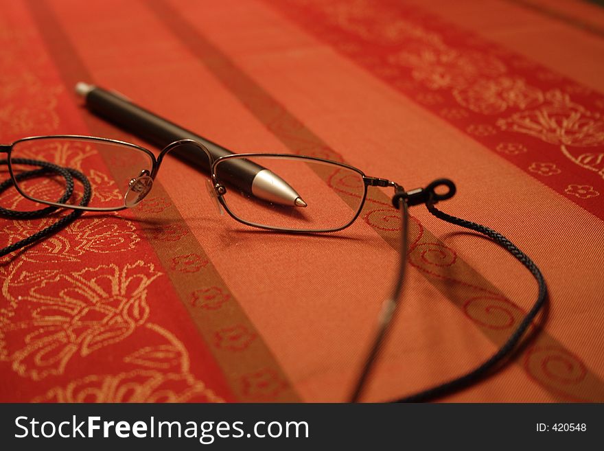 Reading glasses on a table. Reading glasses on a table