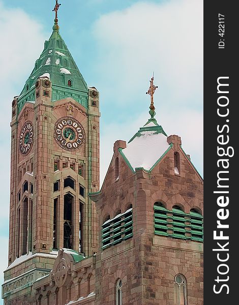 Matching clocks on the faces of a church tower. Matching clocks on the faces of a church tower