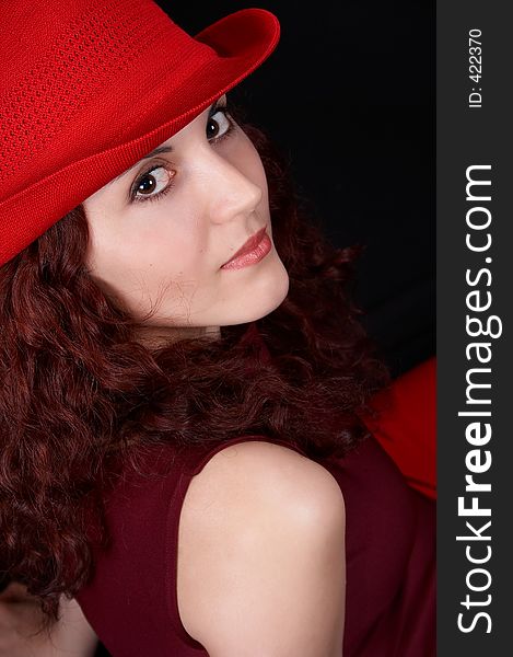 girl with a red hat smiling. girl with a red hat smiling
