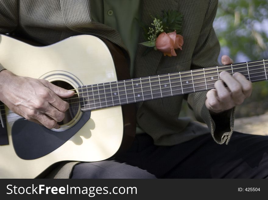 A man strums a love ballad hoping to entice a lady friend. A man strums a love ballad hoping to entice a lady friend.