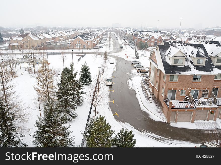 Wideangle, elevated view of a gray winter suburban landscape.