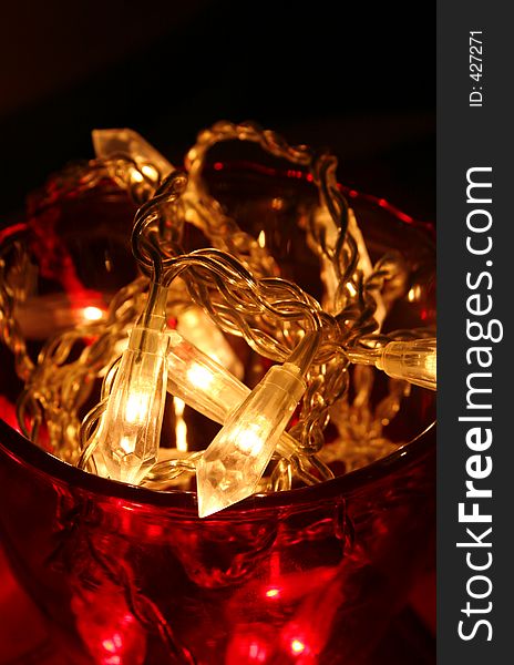 Macro of decorative lights in beautiful red bowl