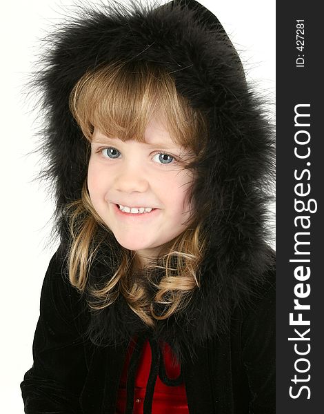 Beautiful little 4 year old girl with blonde hair and blue eyes wearing a black feather hooded sweater. Beautiful little 4 year old girl with blonde hair and blue eyes wearing a black feather hooded sweater.