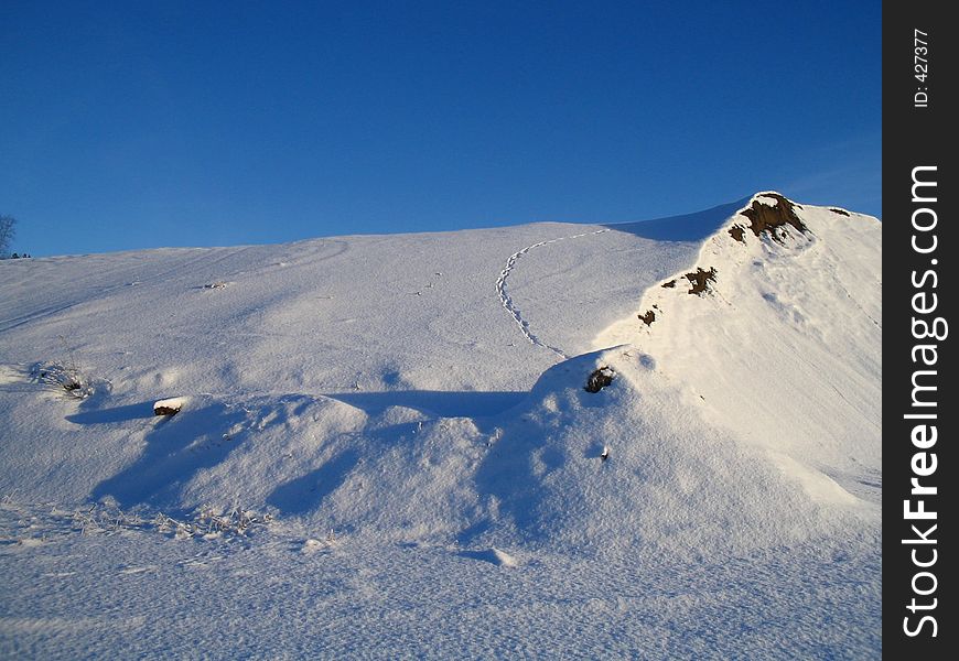 A sandhill covered with snow. A sandhill covered with snow.