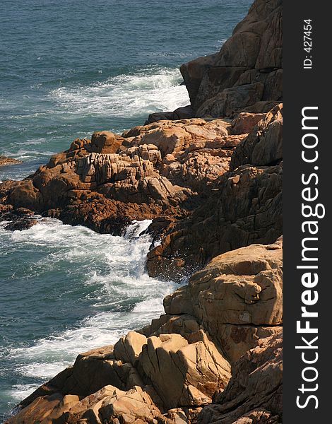 Waves moving in against a rocky shore. Waves moving in against a rocky shore.