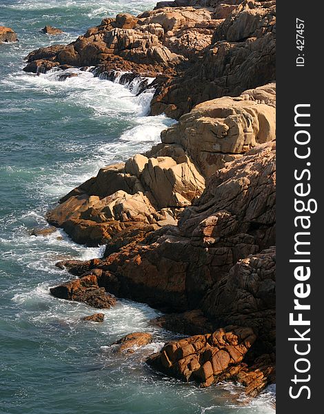 Waves moving in against the rocky shore at Shek O, Hong Kong. Waves moving in against the rocky shore at Shek O, Hong Kong.