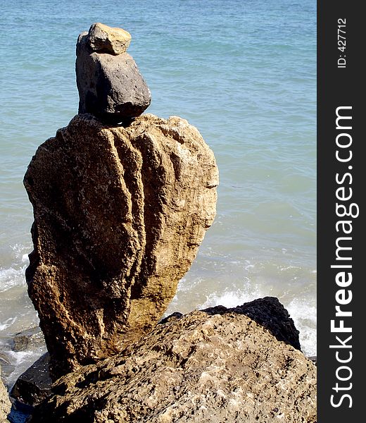 A couple of stones in the pacific balancing ontop of each other. A couple of stones in the pacific balancing ontop of each other.