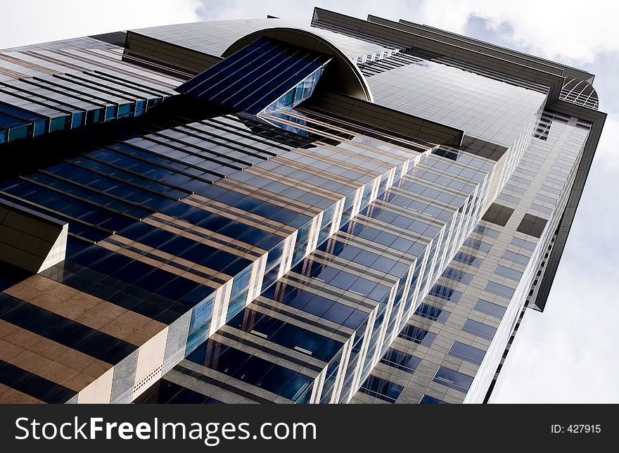 A skyscraper stands tall in Singapore's Central Business District. A skyscraper stands tall in Singapore's Central Business District