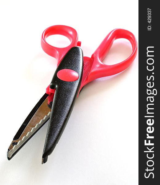 A pair of scissors on a white background. A pair of scissors on a white background