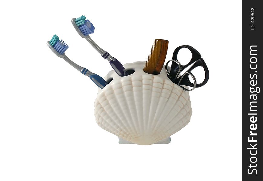 Set of toiletries in seashell holder, isolated with clipping path. Set of toiletries in seashell holder, isolated with clipping path