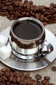 Cup Of Coffee With Lump Sugar And Beans Stock Photography