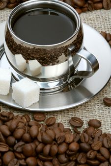 Cup Of Coffee With Lump Sugar And Beans Stock Images