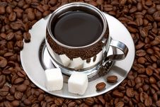 Cup Of Coffee With Lump Sugar And Beans Stock Image