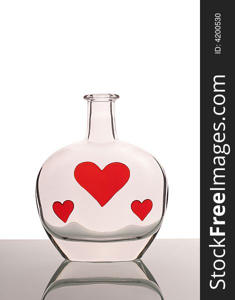 Bottle with three red hearts