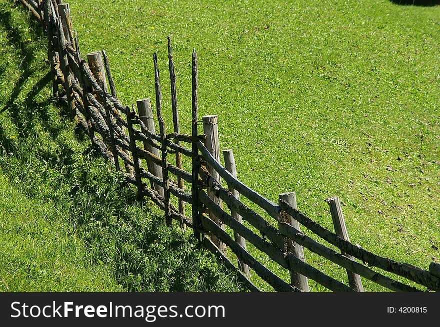 An old, wooden fence in the Alps. An old, wooden fence in the Alps