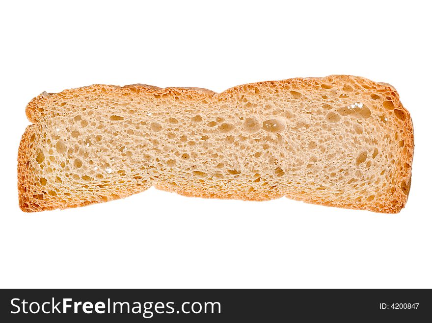 A closed up shot of a slice of crispy bread isolated on a white background