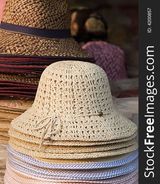 Stacks of hats in a market.