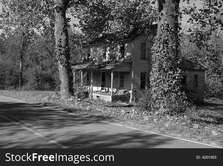 Black and white photo of an old abandoned house. Black and white photo of an old abandoned house