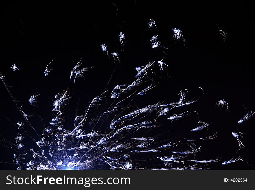 Beautiful black background with sparkling blue fireworks. Beautiful black background with sparkling blue fireworks