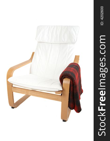 White and wood armchair with a red blanket isolated on white. White and wood armchair with a red blanket isolated on white