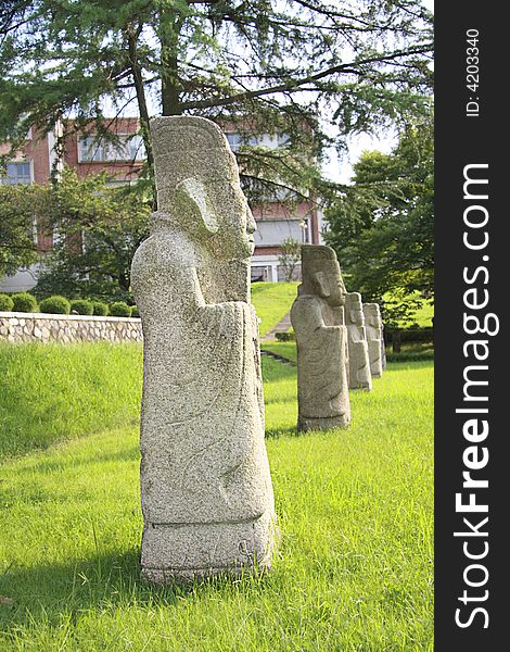 Color photography of a row of statues of confucian officers. Period ofMiddle Ages in Asia. Color photography of a row of statues of confucian officers. Period ofMiddle Ages in Asia.