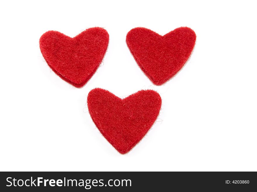 Three red hearts isolated on the white