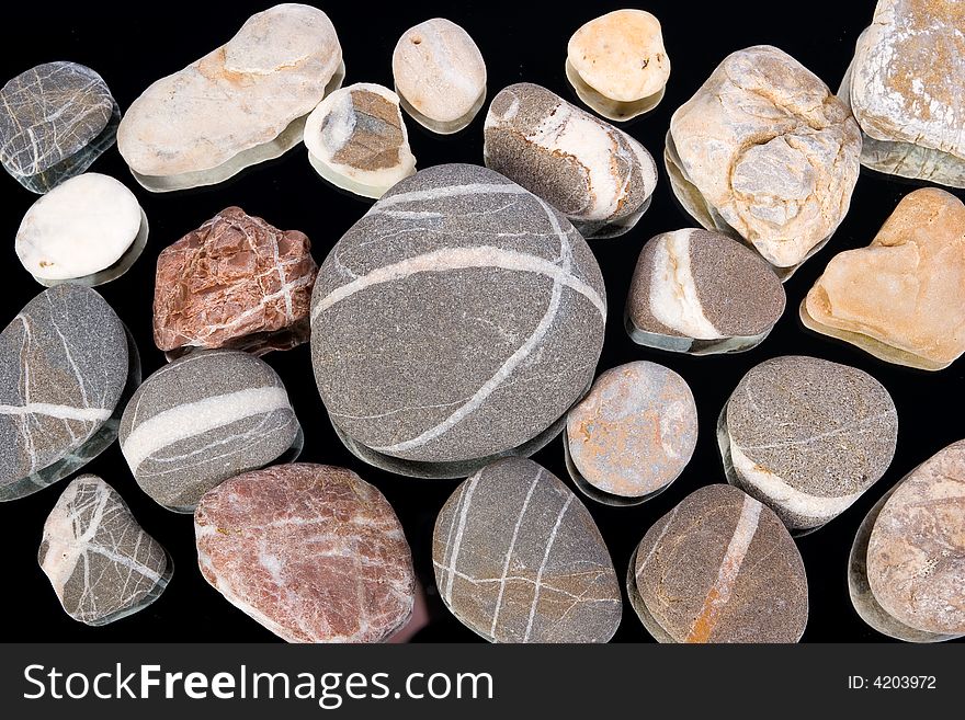 Group of stones on a mirror