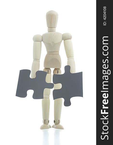 Manikin holds puzzle pieces
