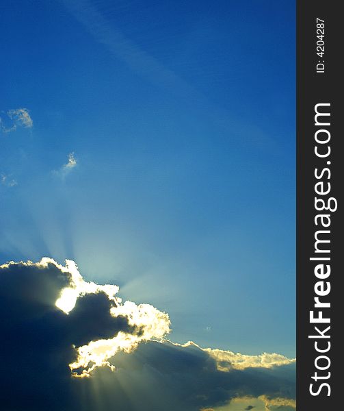 View of deep blue color sky with white and grey clouds. View of deep blue color sky with white and grey clouds