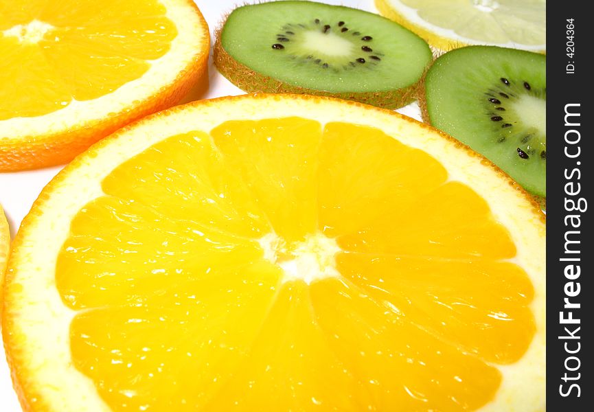 Detail fresh slices kiwi, lemon and oranges. Detail fresh slices kiwi, lemon and oranges