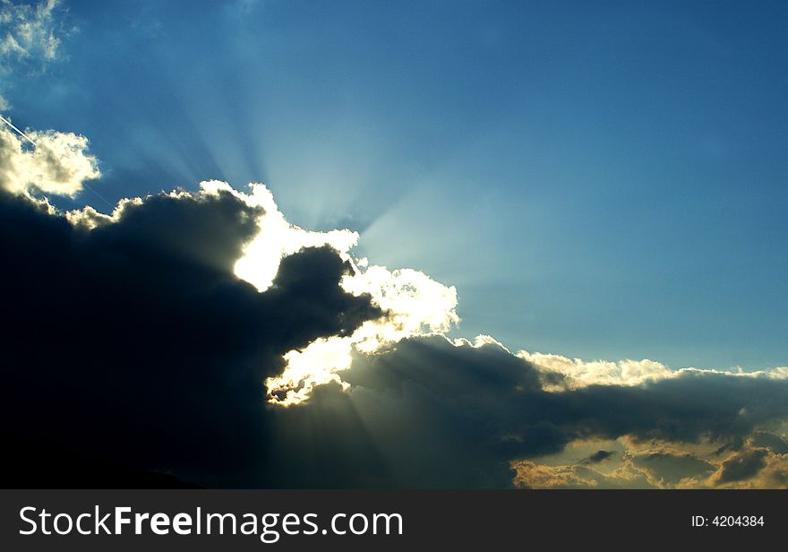 View of deep blue color sky with white and grey clouds. View of deep blue color sky with white and grey clouds