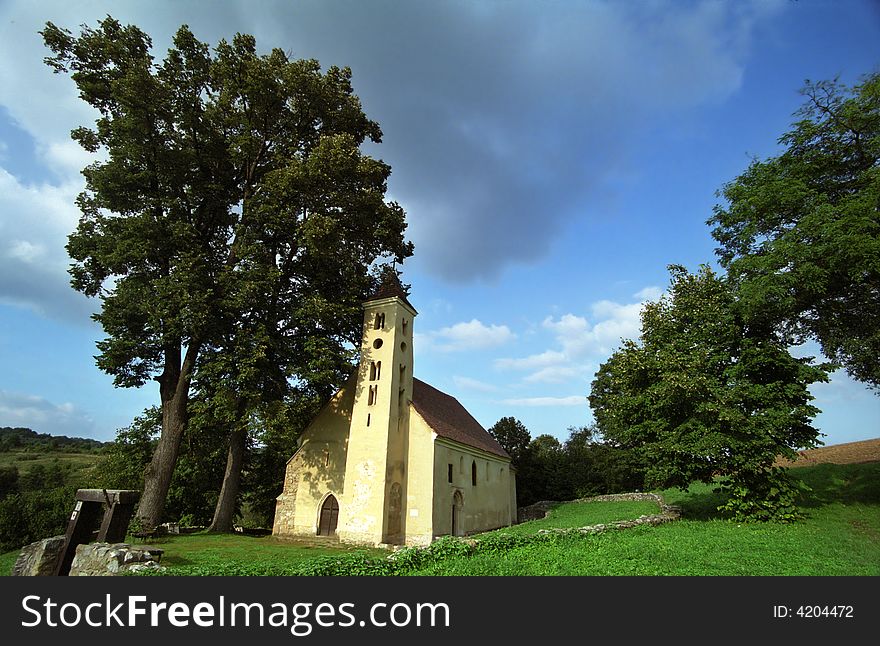 Small village church wit trees