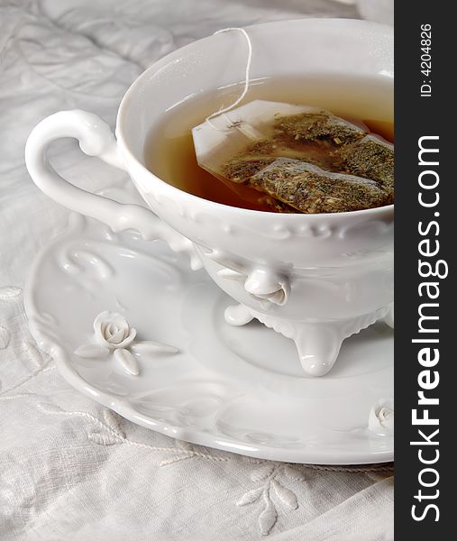 Hot Tea in a white antique tea cup. Hot Tea in a white antique tea cup.