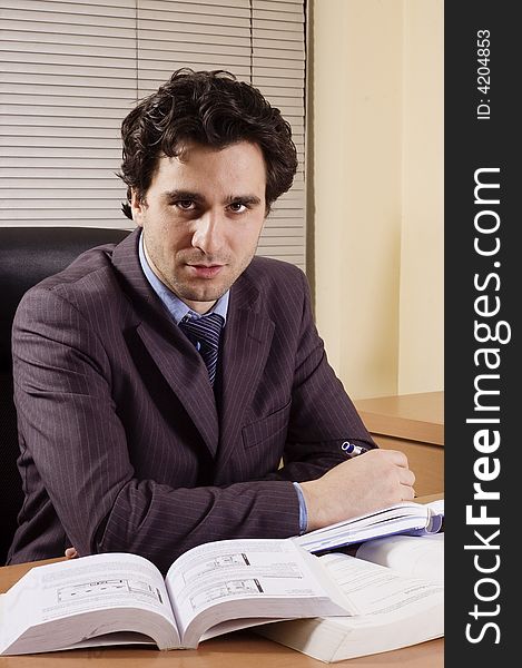 Business man at office at his desk