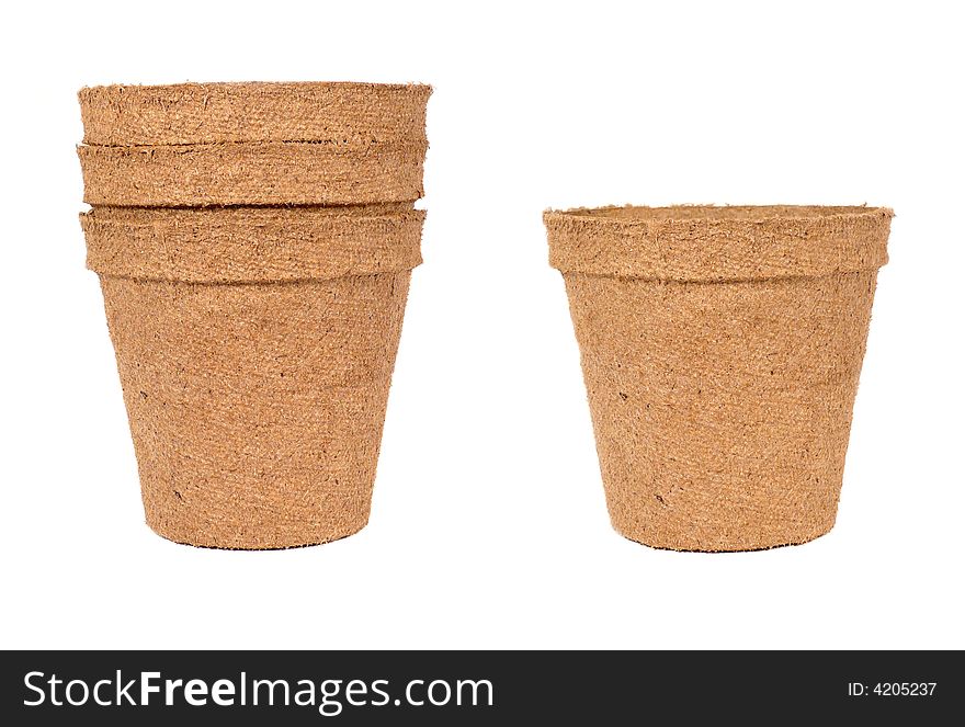 Single and stack of biodegradable planting pots isolated over a white background. Single and stack of biodegradable planting pots isolated over a white background