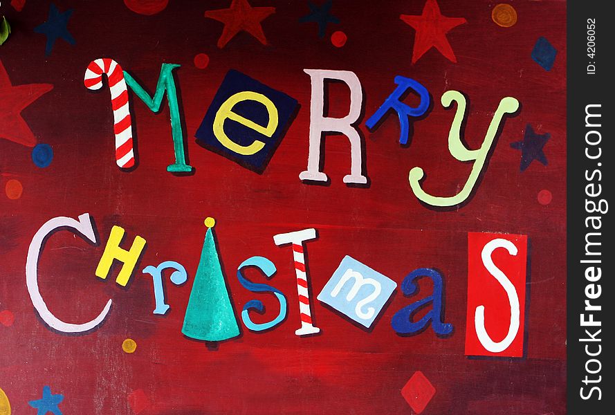 Colorful painted Merry Christmas sign.
