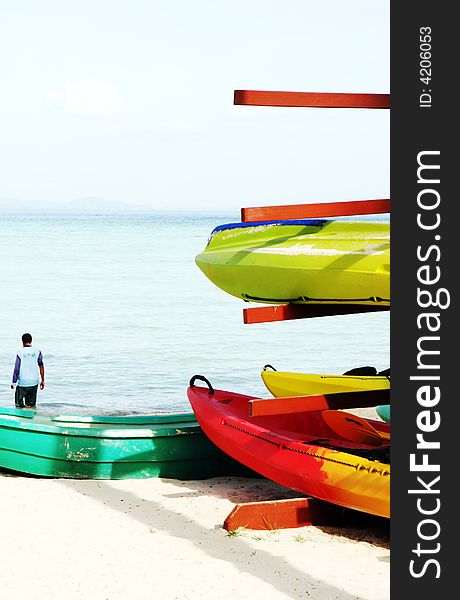 Sea kayaks on the beach - travel and tourism.
