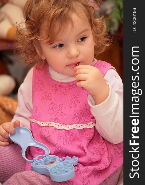 Little girl with toy makeup