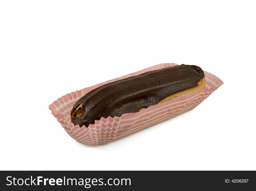 Isolated eclair with chocolate fondant on a paper