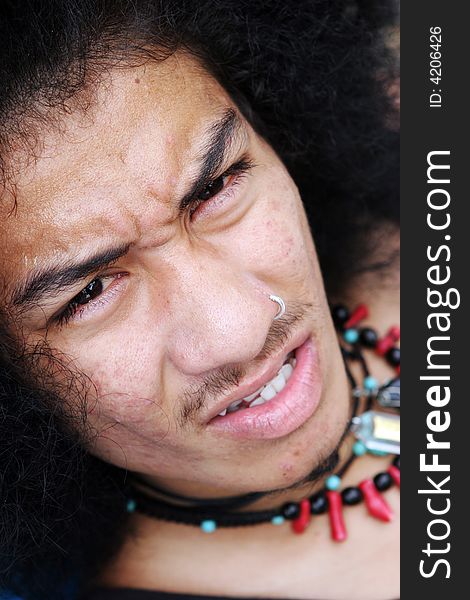 Close-up portrait of a young Thai man.