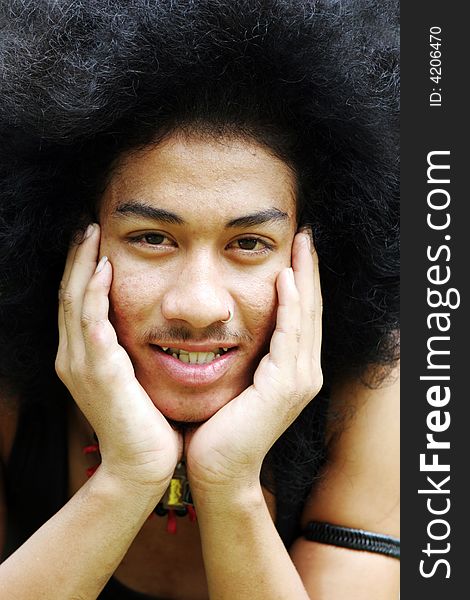 Close-up portrait of a young Thai man.