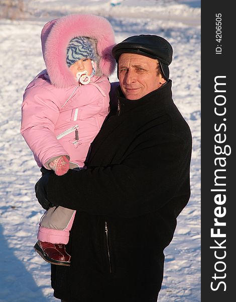 Grandfather And Grandchild On Hands