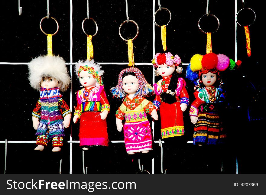 Chinese dolls of Naxi ethnic group Yunnan China key ring,attired with colorful local clothes. Chinese dolls of Naxi ethnic group Yunnan China key ring,attired with colorful local clothes.