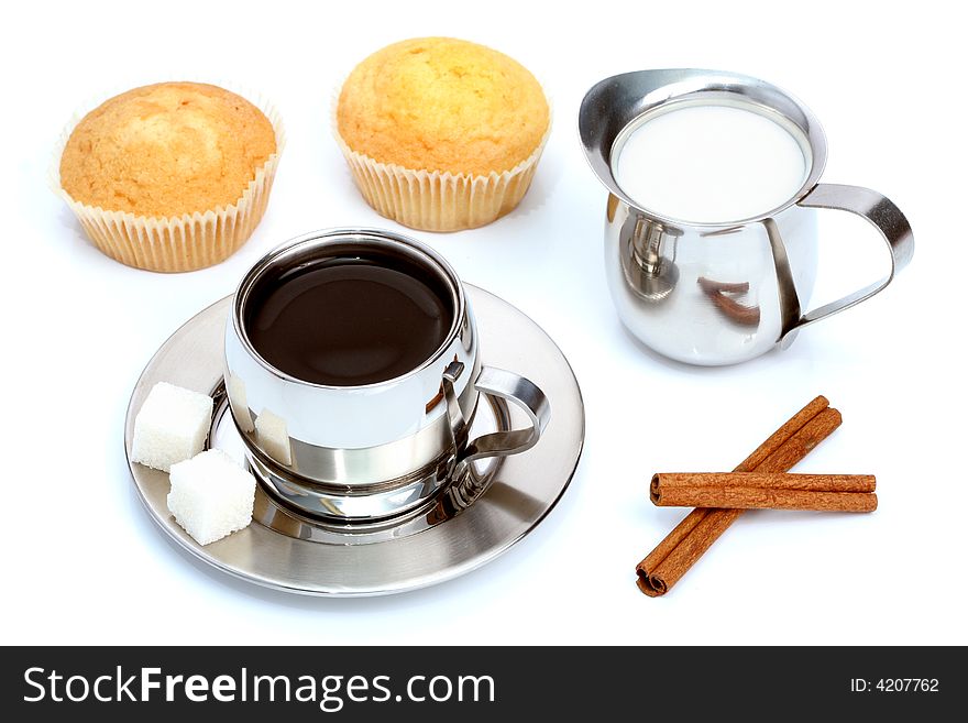 Cup of black coffee with muffin, milk and cinnamon 1